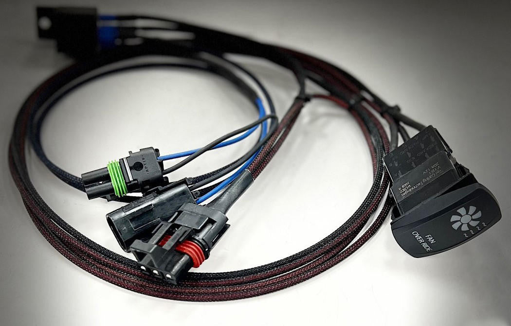 UTV Inc plug and play fan override kit, a braided wiring harness with factory style connectors and a black rocker switch labelled Fan Over Ride